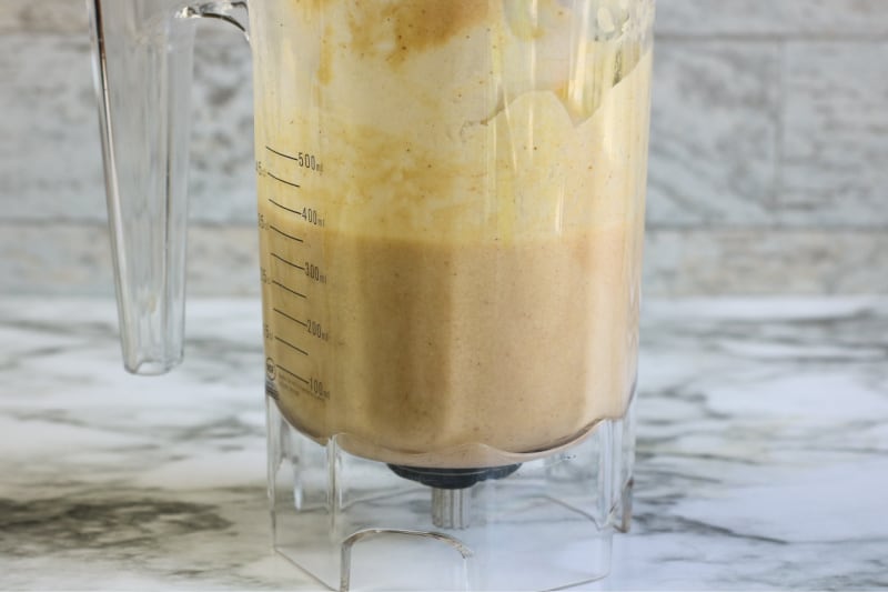 a blender with a coffee drink mixed inside it