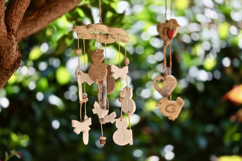wind chimes hanging from a tree branch
