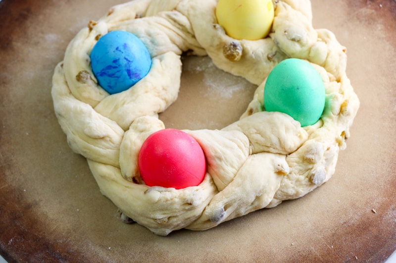 bread dough with colorful Easter eggs in it