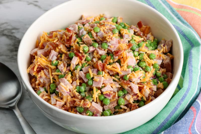 This ham pea salad recipe is a simple spring recipe using peas, ham, and bacon. Try this classic pea salad with ranch dressing today.