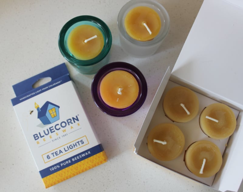 several boxes of candles on a white counter