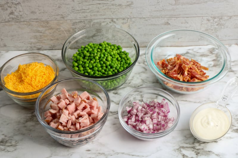 ingredients in small bowls on a white counter