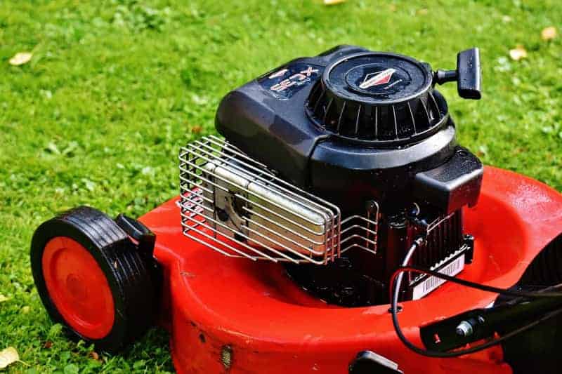 a close up of a red lawnmower