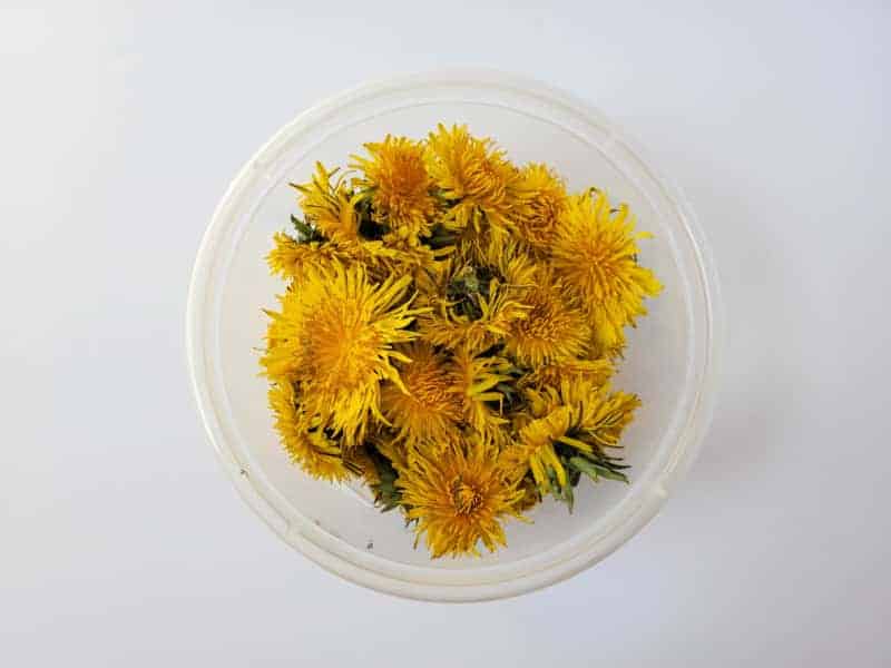 dandelions in a glass bowl