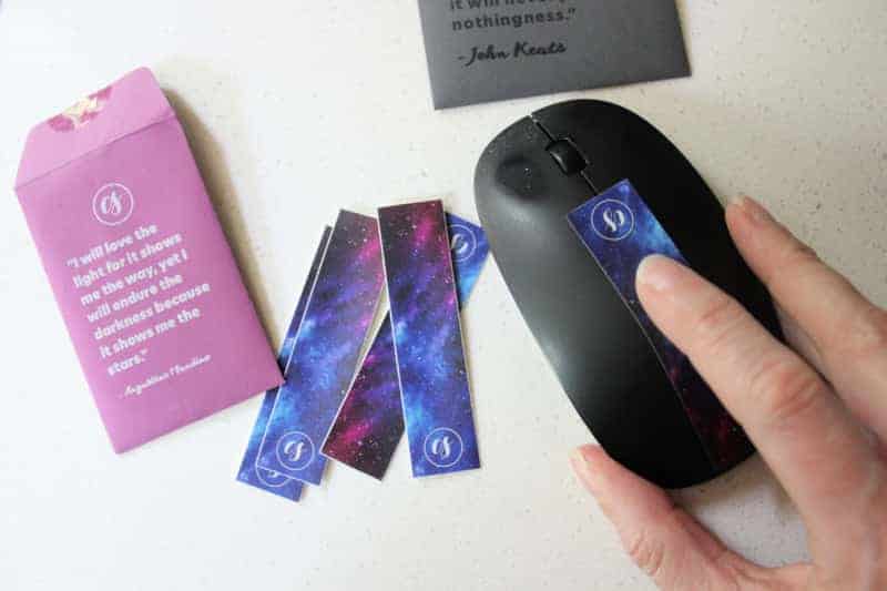 a pack of sensory strips with a calm strip on a black mouse