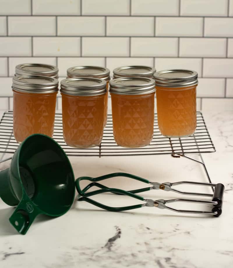 jars of jelly cooling on a rack