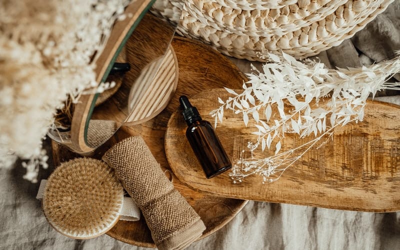 close up of massage oils and cloths on a natural background