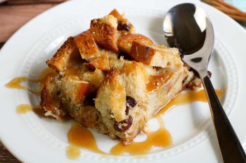 bread pudding with caramel sauce on a plate