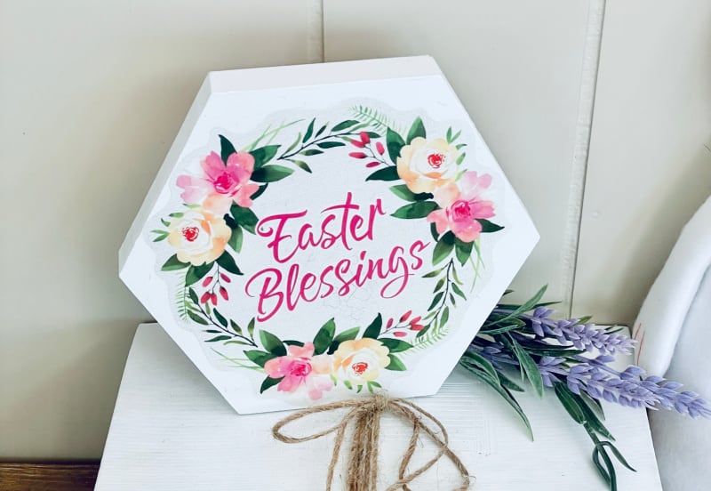 an Easter tray on a white book with purple flowers