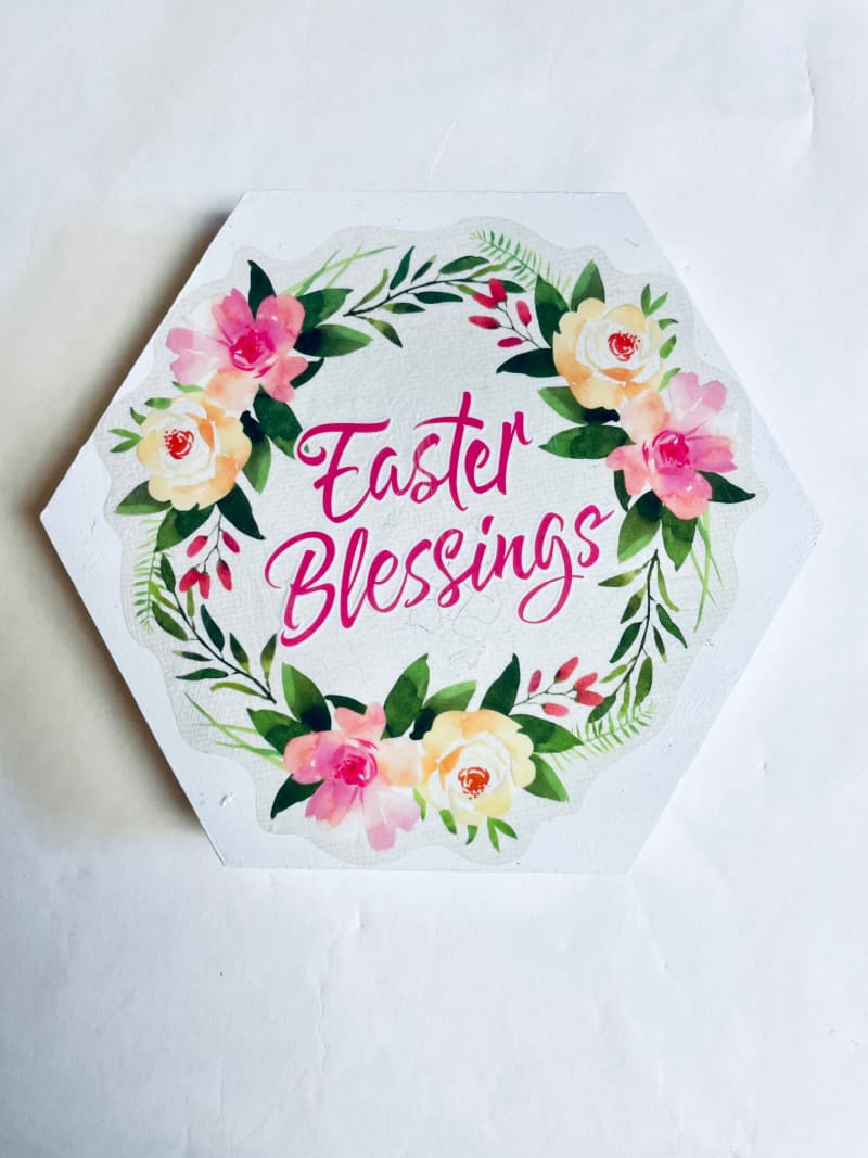 a white floral Easter sign on the wall