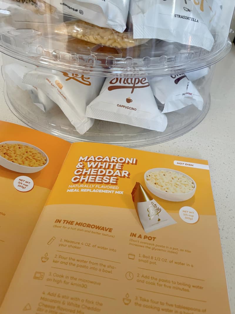 a meal plan booklet near the So Shape packets