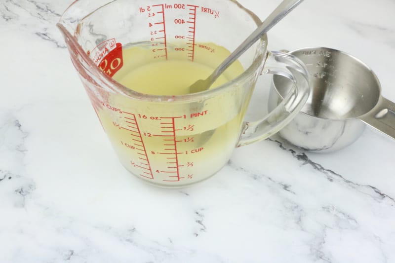 dissolving sugar in a measuring cup