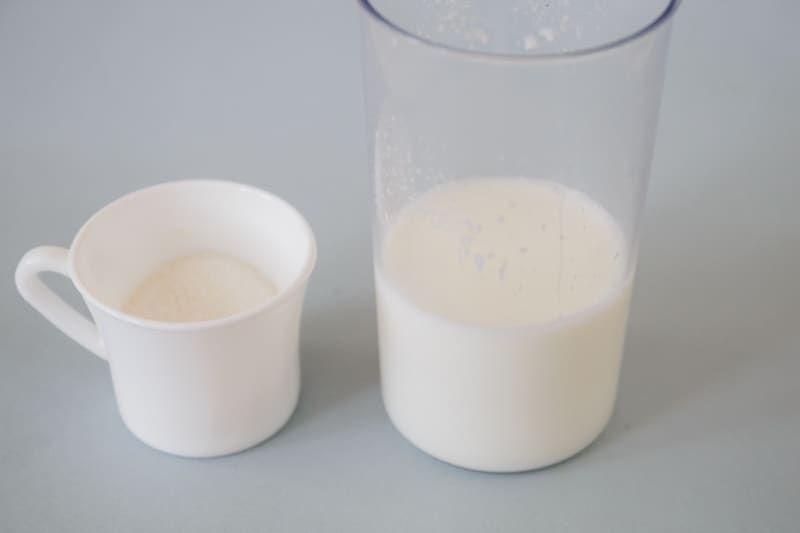 milk and sugar in small glass containers