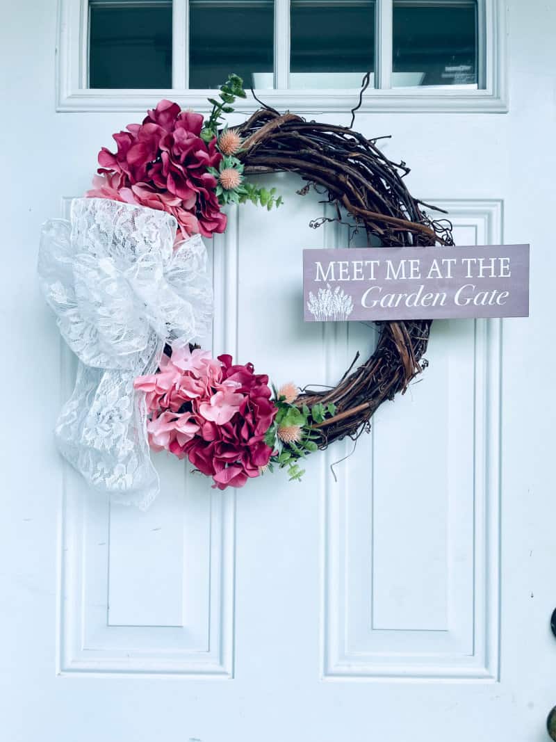 Make this hydrangea door wreath from faux flowers and add a bit of elegance to your front door. This is one of my favorite summer wreaths.