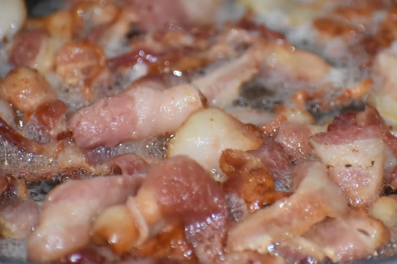 frying bacon in a pan