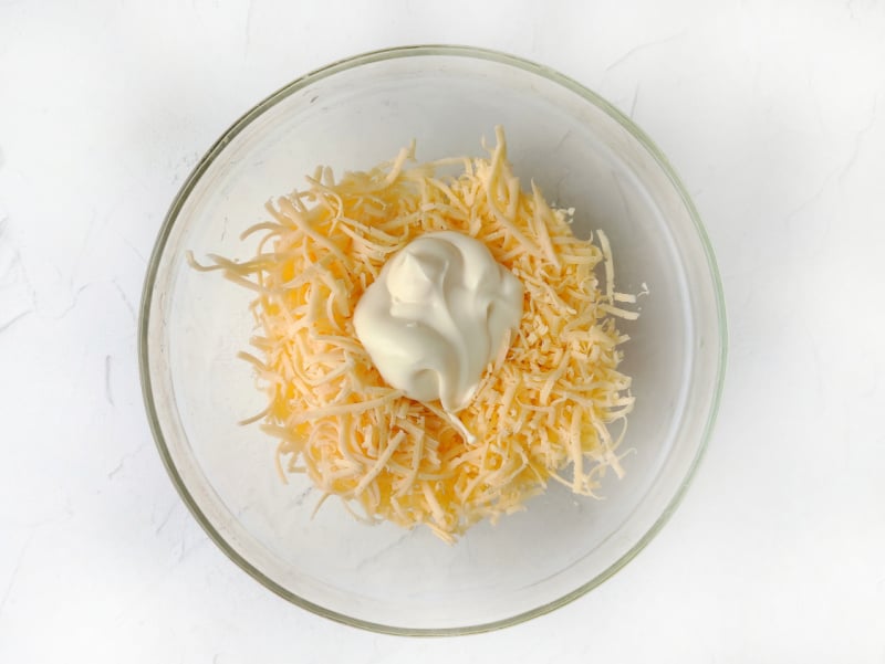 cheese and mayonnaise in a bowl