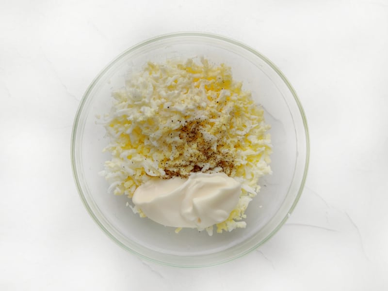 grated egg and mayonnaise in a bowl