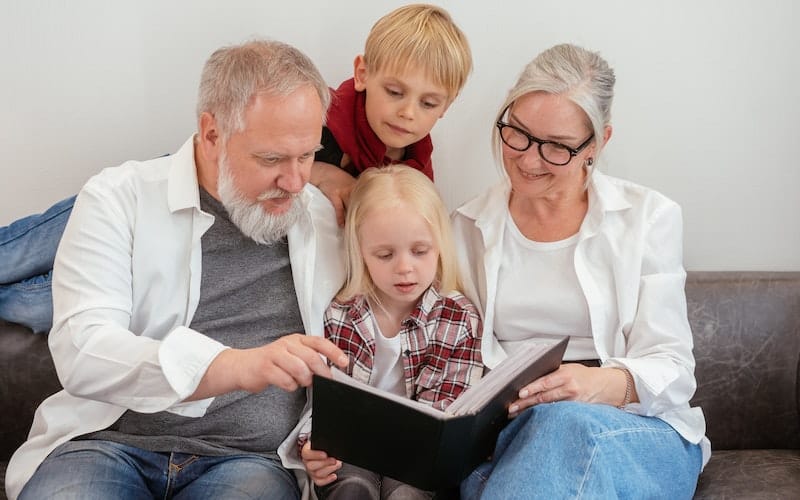 grandparents reading to their grandchildren