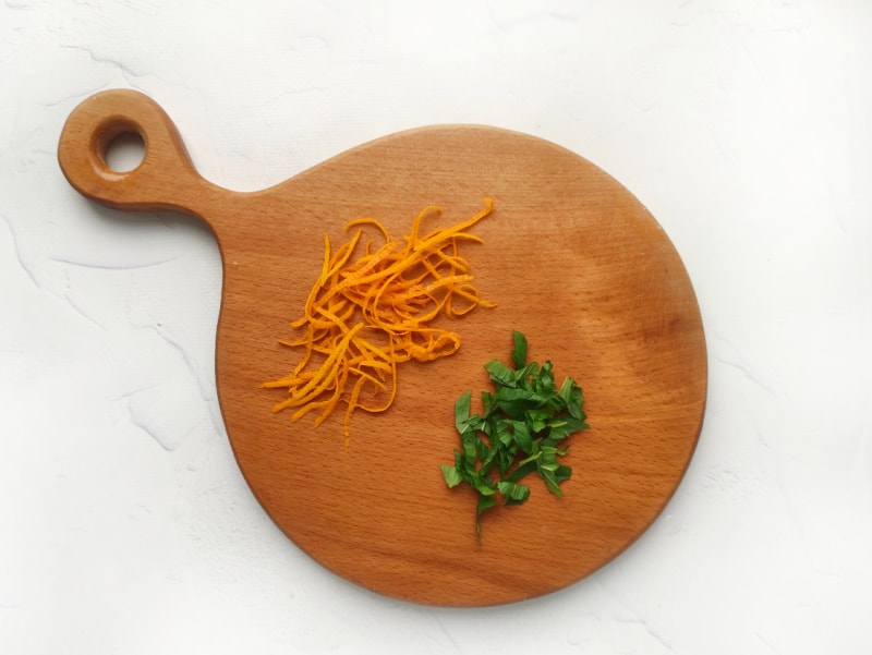 mint and orange on a cutting board