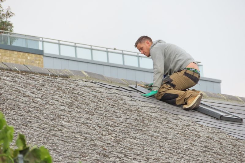 man fixing a roof