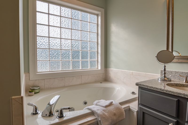 bathtub with a large window
