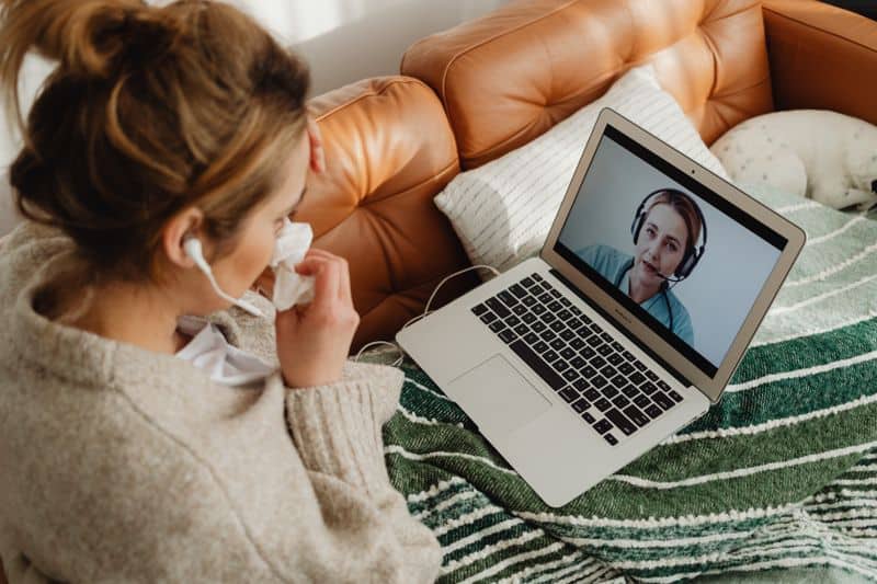 woman using connected technology for a health appointment