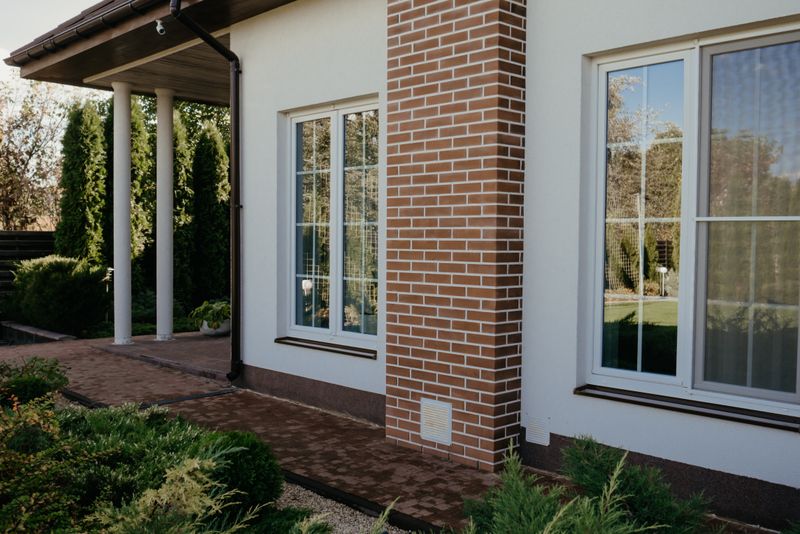 a brick home with casement windows