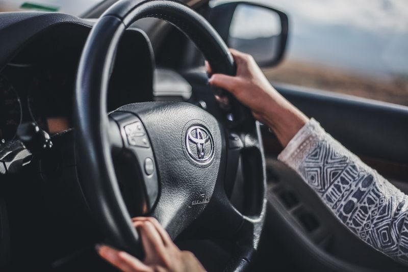 hands on a steering wheel