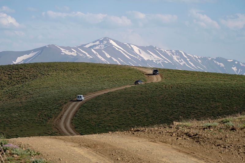 trucks on a dirt road
