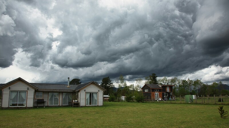 house with storm clouds